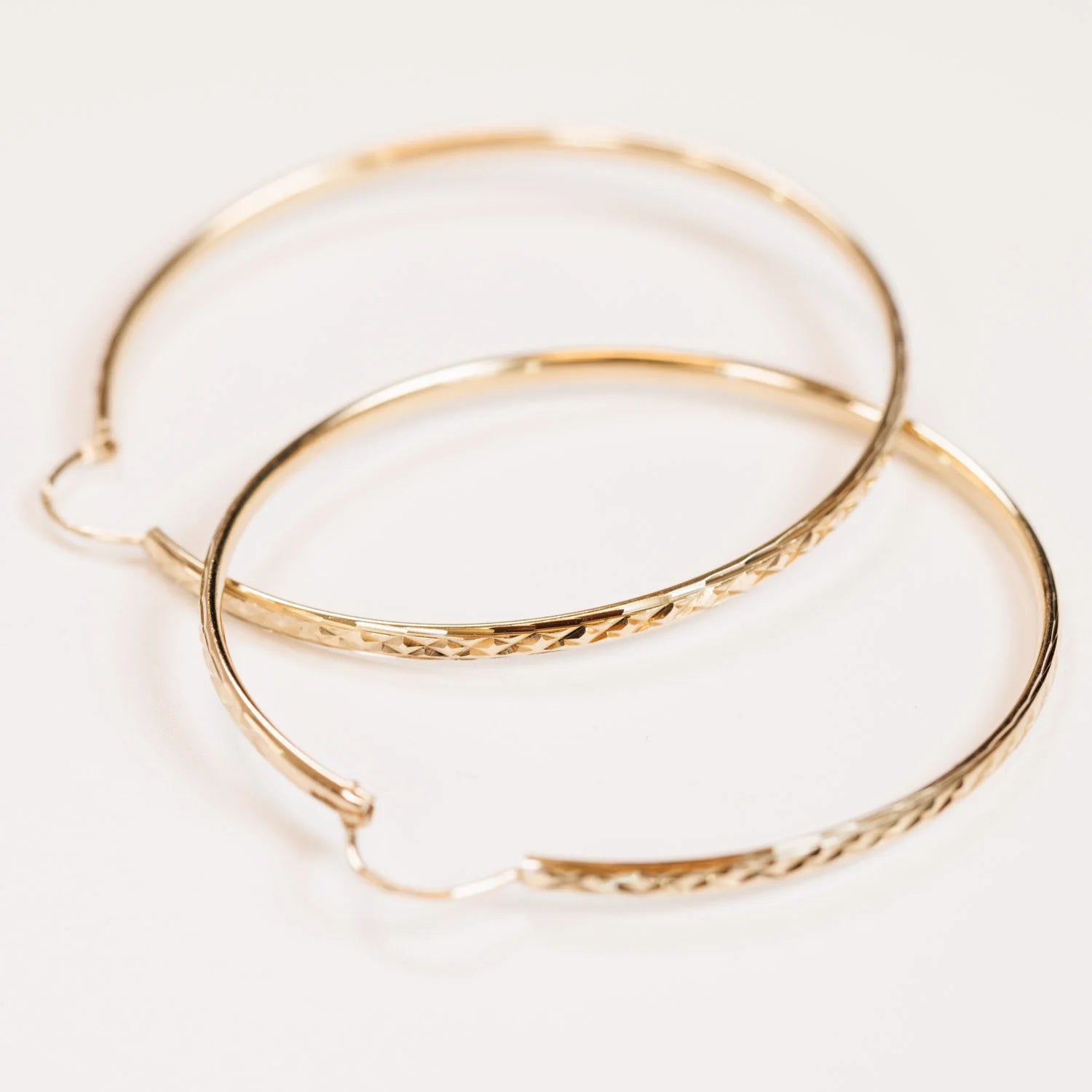 Gold Bangles on a white background