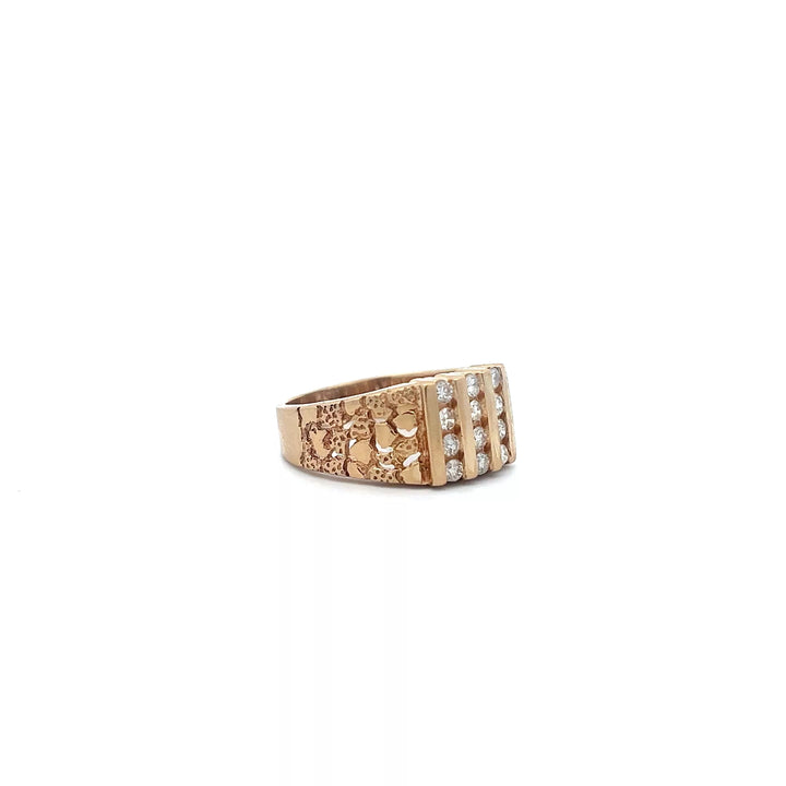 A gold ring with pearls and diamonds.