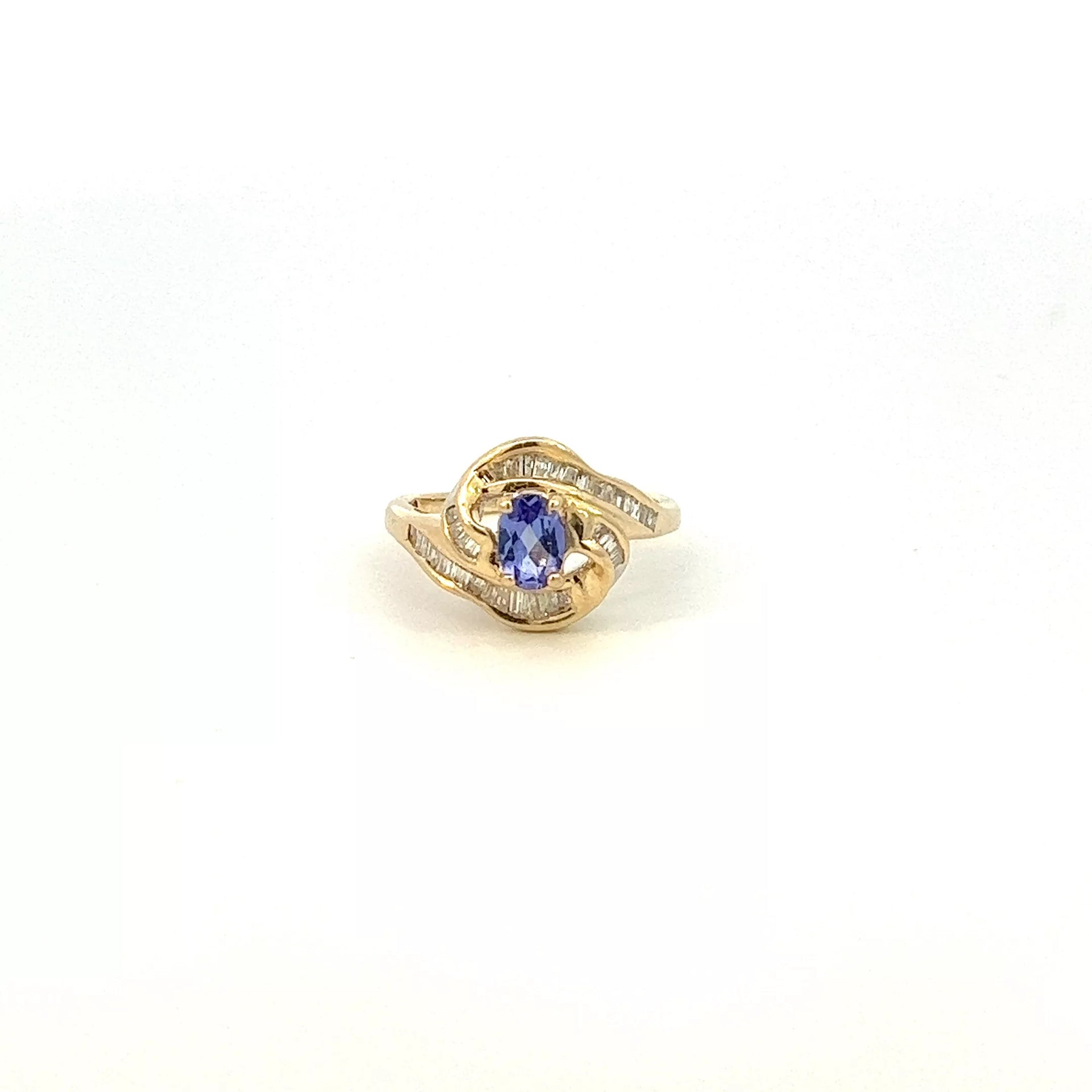 A tanzanite and diamond ring in yellow gold.