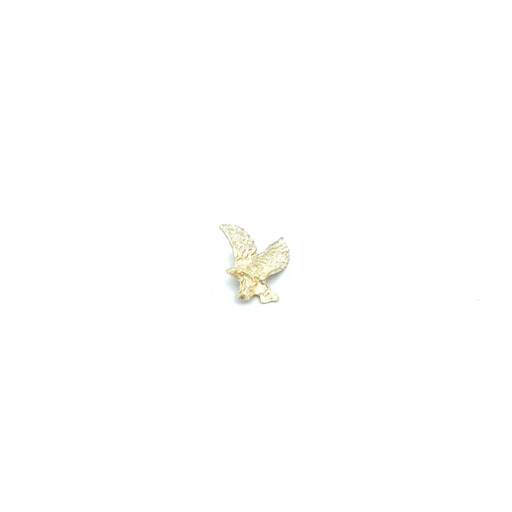 A gold plated eagle on a white background.