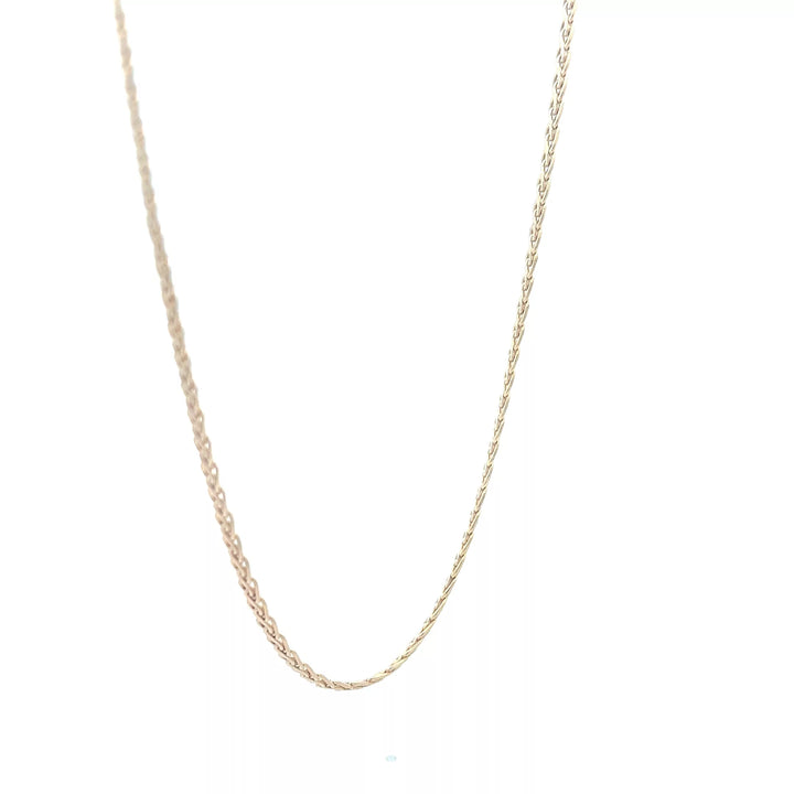 A gold chain necklace on a white background.