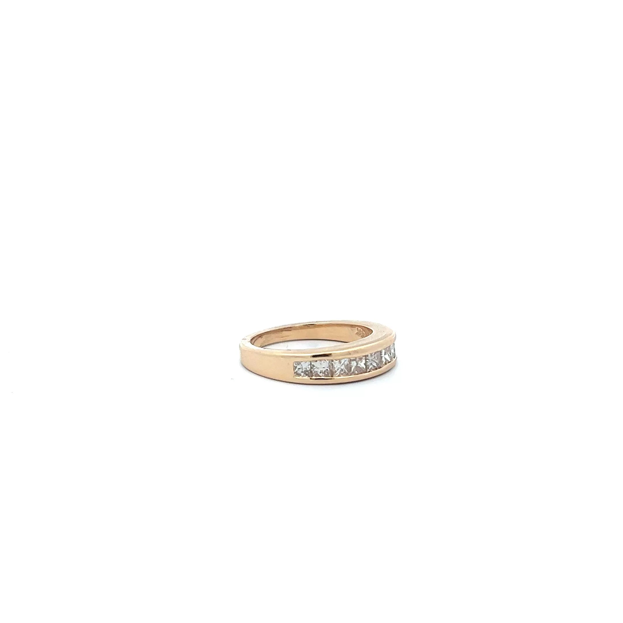 An 18k yellow gold diamond band ring.