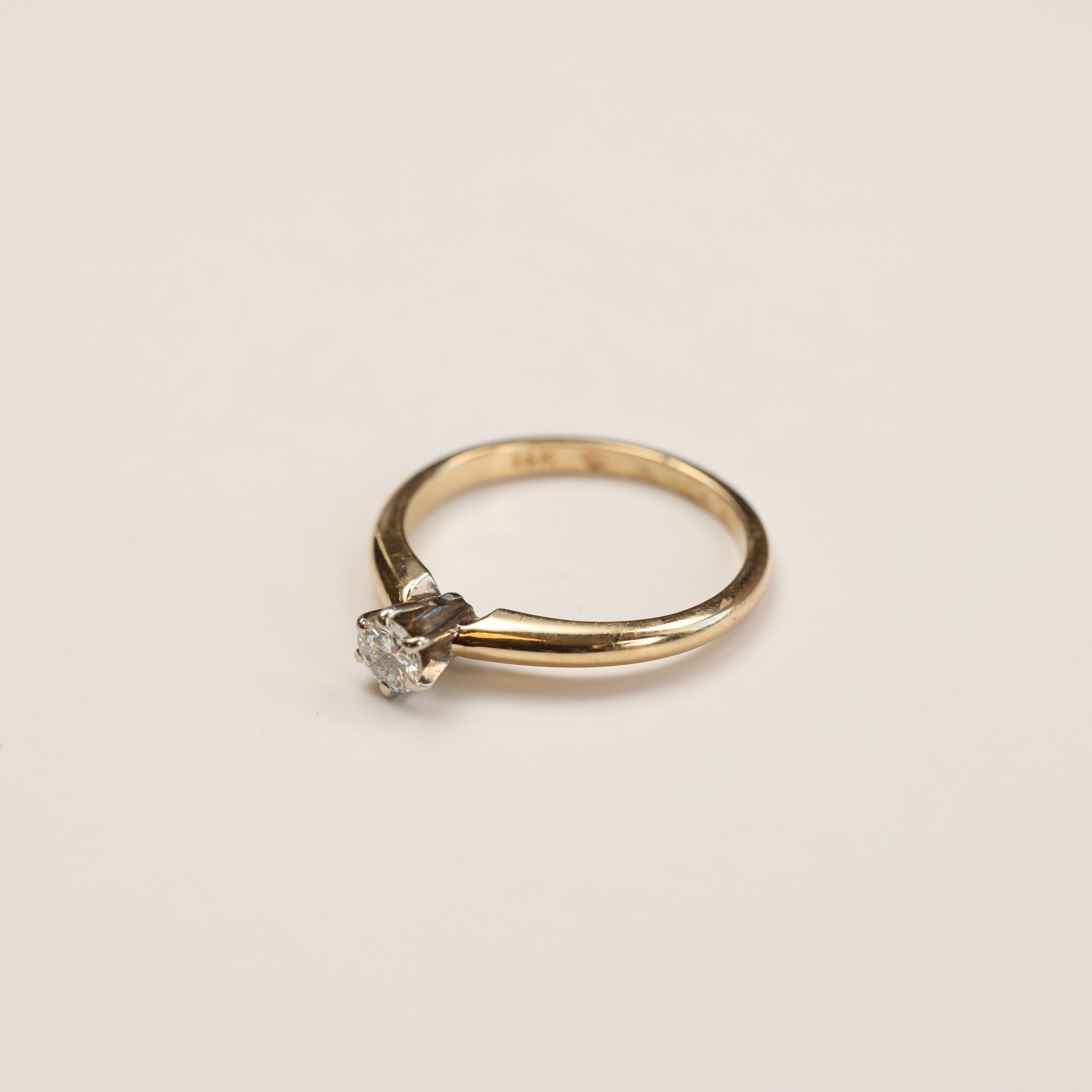 A 14 Karat Yellow Gold Tanzanite Diamond Ring - Size 5 is shown on a plain white background.