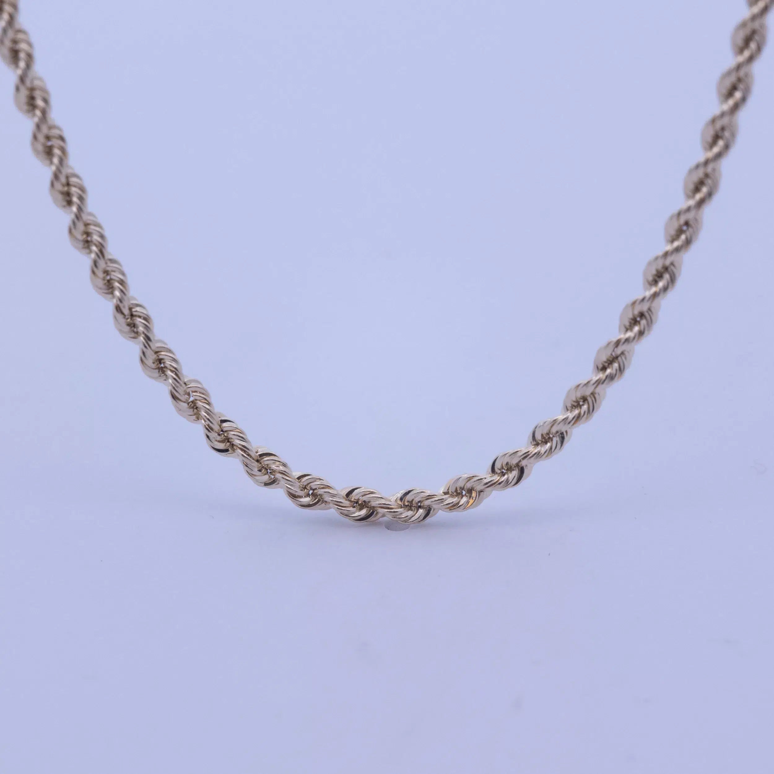 A 14 Karat Yellow Gold Rope Chain on a white background.