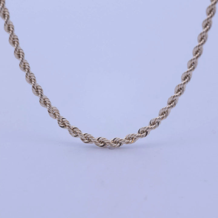 A 14 Karat Yellow Gold Rope Chain on a white background.