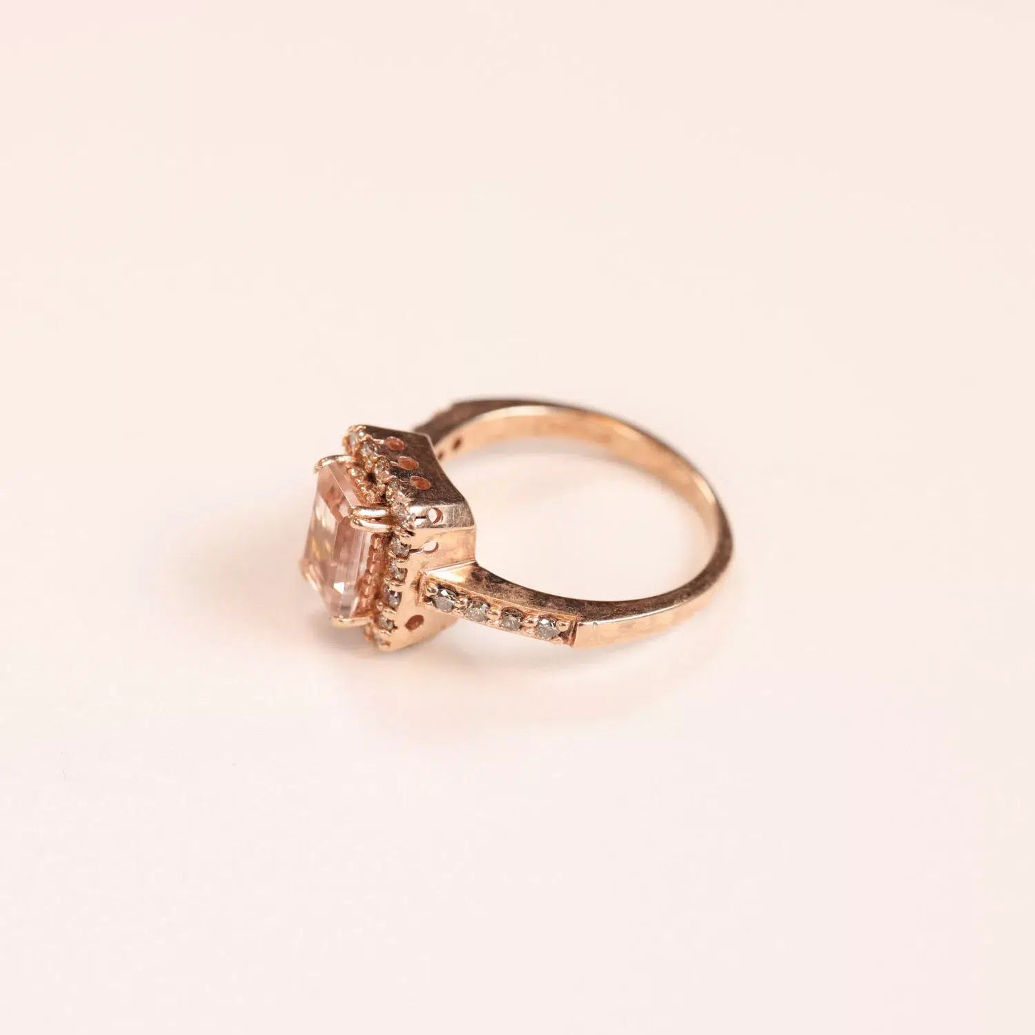 A 14 Karat Yellow Gold Comfort Fit Band with a morganite and diamonds.