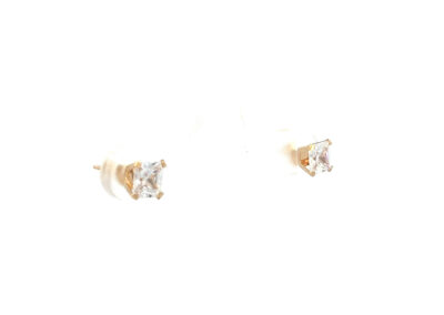 A pair of diamond stud earrings in yellow gold.