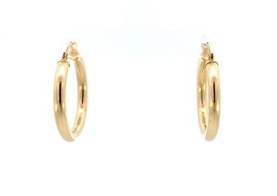 A pair of gold hoop earrings on a white background.