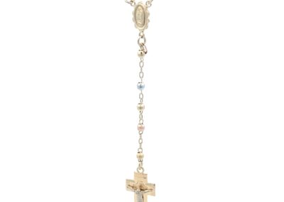 A gold - plated rosary necklace with a cross on it.