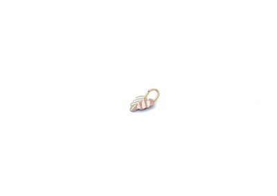A small white and pink striped charm on a white background.