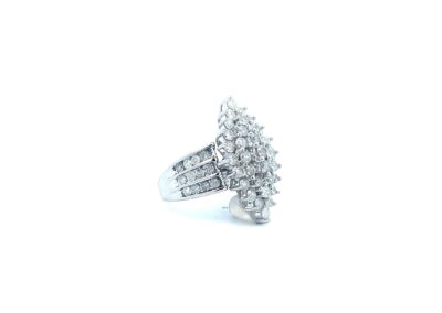 A white gold ring with a cluster of diamonds.