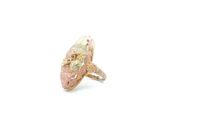 A ring with a pink and yellow stone.