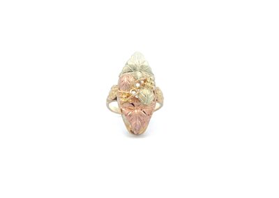 A ring with a pink, yellow, and white stone.