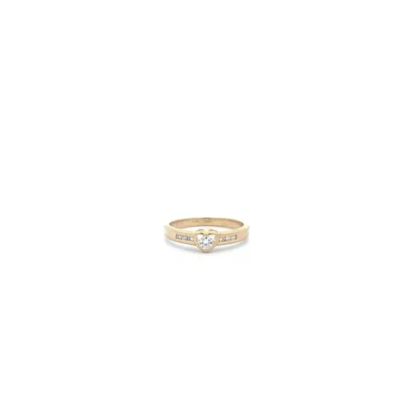 A gold ring with a diamond in the center.