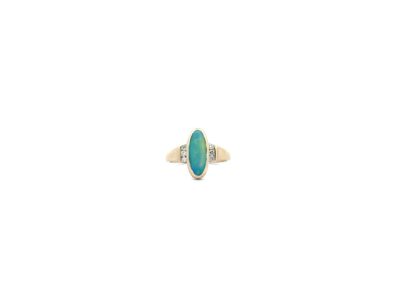 A gold ring with a turquoise stone and diamonds.