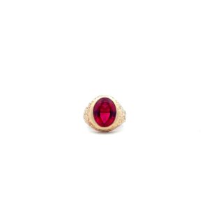 A gold ring with a ruby stone.