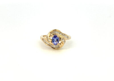 A tanzanite and diamond ring in yellow gold.