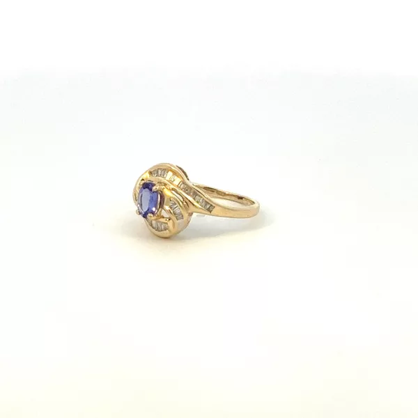 A yellow gold ring with a tanzanite stone.