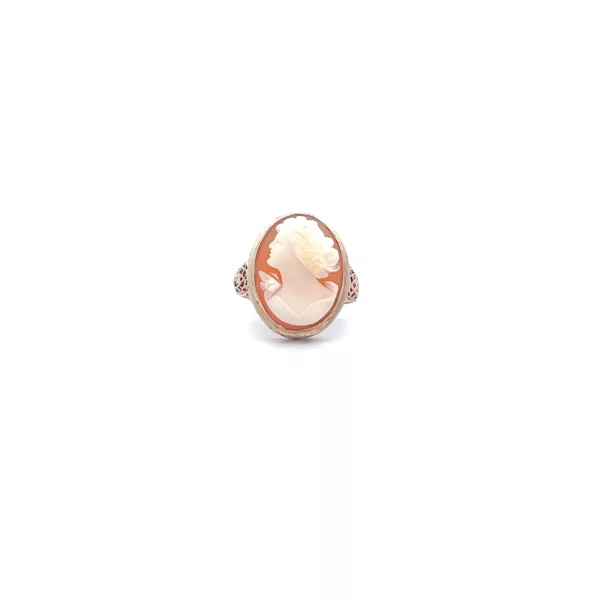 A rose gold ring with a white stone.