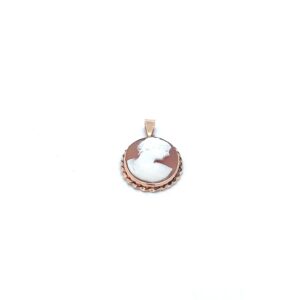 A white and brown cameo pendant on a white background.