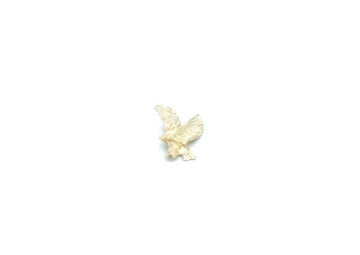 A gold plated eagle on a white background.