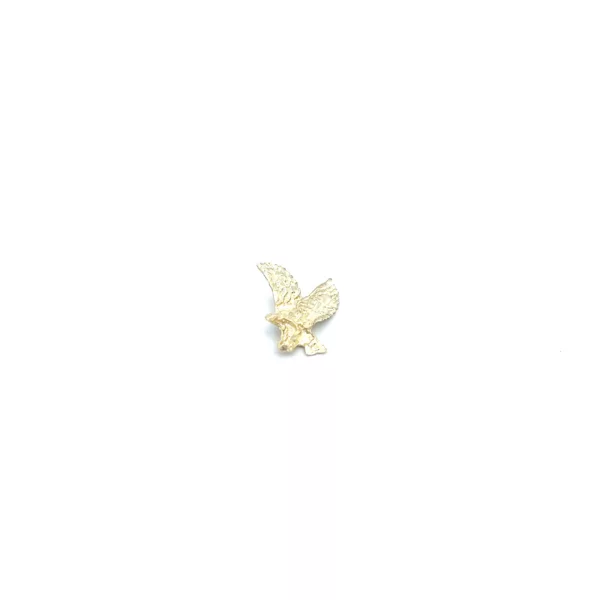A gold plated eagle on a white background.