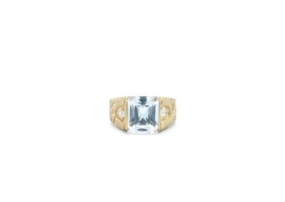 An aquamarine and diamond ring on a white background.