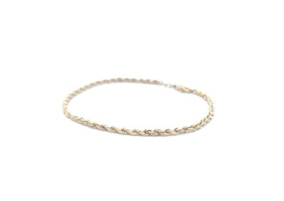 A gold plated bracelet with a rope design.