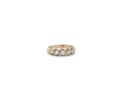 A yellow gold ring with three diamonds.