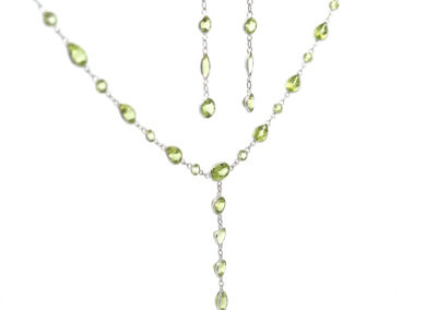 Sterling silver peridot necklace and earring set with the 14 Karat Yellow Gold Cross Pendant.