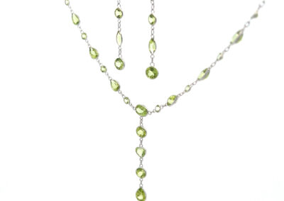 Peridot necklace and earrings set with the 14 Karat Yellow Gold Cross Pendant.