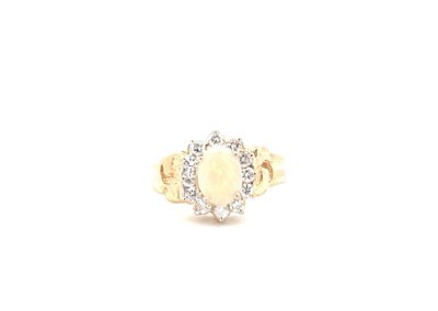 A 14 Karat Yellow Gold Cross Pendant opal and diamond ring.