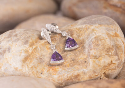 Amethyst and diamond stud earrings made of 14 Karat White Gold.