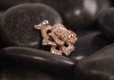 A rose gold rose with diamonds