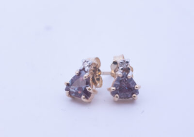 A pair of 14 Karat Yellow Gold Tanzanite Clear Stone stud earrings.