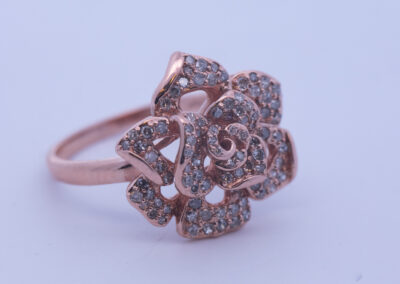 10 Karat Rose Gold Diamond Rose Ring with diamonds.