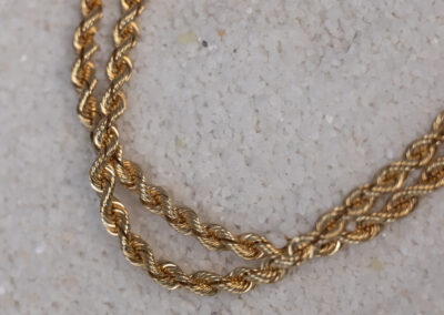 A 14 Karat Yellow Gold Rope Chain featuring a 14 karat yellow gold Rope Chain.
