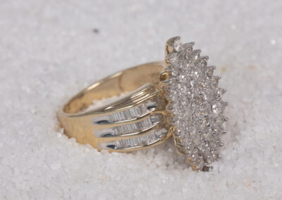 A stunning 14 Karat yellow gold white stone tennis bracelet adorned with sparkling diamonds.