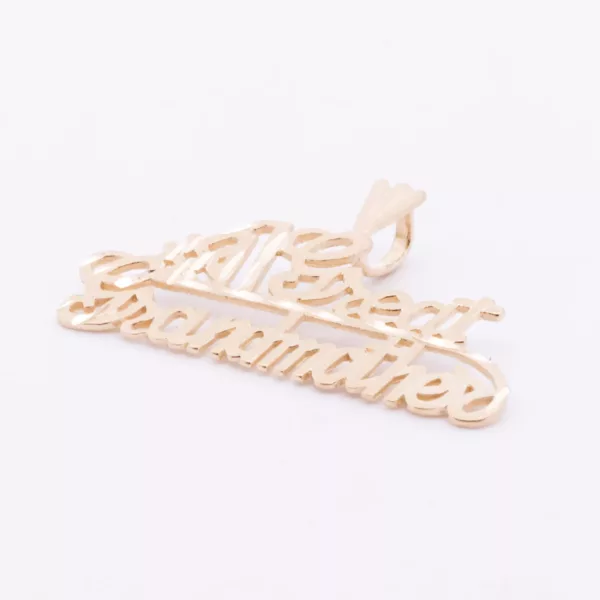 A 24 karat yellow gold plated pendant with the word grandma on a delicate 14 karat yellow gold fashion chain.