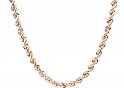 A 14 Karat Yellow Gold Fashion Chain paired with a white background.