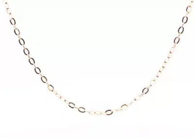 A 14 Karat Yellow Gold Fashion Chain with a small circle on it in rose gold.