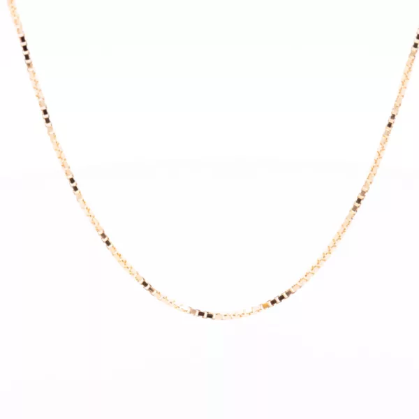A 14 Karat Yellow Gold Fashion Chain necklace with black beads.