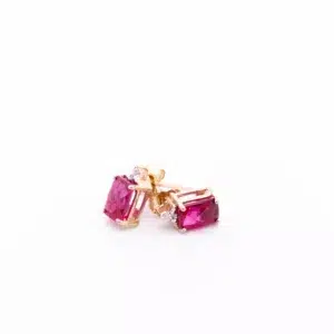 14 Karat yellow gold ruby and diamond stud earrings.