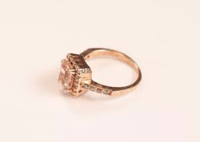 A 14 Karat Yellow Gold Comfort Fit Band with a morganite and diamonds.