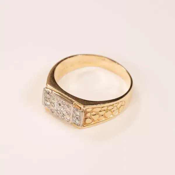 Peach Tourmaline ring with a square setting of 14K YG diamonds on a simple white background.